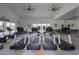 Bright and airy fitness center featuring modern treadmills and exercise equipment with motivational wall art at 13244 N 146Th Ln, Surprise, AZ 85379