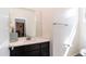Powder room with single vanity, modern fixtures, and tile floors at 14338 W Bronco Trl, Surprise, AZ 85387