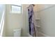 Bright bathroom featuring a shower-tub combo with modern fixtures at 14338 W Bronco Trl, Surprise, AZ 85387