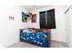 bedroom featuring carpet, playful decor, and natural light at 14338 W Bronco Trl, Surprise, AZ 85387