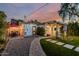 The backyard boasts a stone path, covered patio, and outdoor seating area with string lights at 1522 W Willetta St, Phoenix, AZ 85007