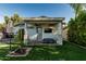 Covered backyard patio with ceiling fans, an outdoor television and exterior access at 1522 W Willetta St, Phoenix, AZ 85007