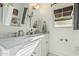 Bright bathroom featuring dual sinks, white marble countertops, and modern fixtures at 1522 W Willetta St, Phoenix, AZ 85007