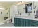 Bathroom featuring a double vanity, a walk-in shower, and modern fixtures at 1522 W Willetta St, Phoenix, AZ 85007