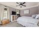 Comfortable bedroom featuring a ceiling fan, natural lighting, and ample space at 1522 W Willetta St, Phoenix, AZ 85007