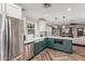 Open kitchen featuring an island with marble countertops and seamlessly connecting to the living area at 1522 W Willetta St, Phoenix, AZ 85007