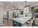 Charming kitchen features white cabinets, marble countertops, and a breakfast bar with seating at 1522 W Willetta St, Phoenix, AZ 85007