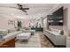 Spacious living area boasts a large television, chic furnishings, and an open layout design at 1522 W Willetta St, Phoenix, AZ 85007