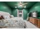 Cozy bedroom with a large window, neutral carpet, and modern decor at 1522 W Willetta St, Phoenix, AZ 85007