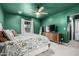 Spacious bedroom with a ceiling fan, neutral carpet, and a serene atmosphere at 1522 W Willetta St, Phoenix, AZ 85007