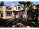 View of the home's backyard, featuring a brick-paved patio and desert landscaping, perfect for outdoor living and entertaining at 16644 N 33Rd St # 101, Phoenix, AZ 85032