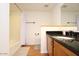 Bathroom with granite countertop, wood cabinets, and shower at 16644 N 33Rd St # 101, Phoenix, AZ 85032