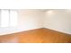 Empty bedroom with light wood floors and a large window at 16644 N 33Rd St # 101, Phoenix, AZ 85032