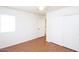 Bedroom with lots of light, wood floors, and closet space at 16644 N 33Rd St # 101, Phoenix, AZ 85032