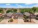 Home with solar panels close to community lake surrounded by mature landscaping at 17115 N Larkspur Ln, Surprise, AZ 85374