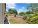 Backyard featuring green fence, plants and chairs at 17115 N Larkspur Ln, Surprise, AZ 85374