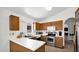 Kitchen featuring stainless steel appliances and eat-in area at 17115 N Larkspur Ln, Surprise, AZ 85374