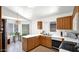 The kitchen features wood cabinets and white countertops at 17115 N Larkspur Ln, Surprise, AZ 85374