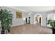 Open living room featuring tile flooring, neutral paint, and arched doorways at 17115 N Larkspur Ln, Surprise, AZ 85374