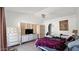 The bedroom features white walls, tile flooring, and a ceiling fan at 17115 N Larkspur Ln, Surprise, AZ 85374