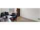 The office is well-lit with tile floors and a dark desk at 17115 N Larkspur Ln, Surprise, AZ 85374