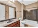 Bathroom with granite vanity, shower-over-tub combo, and neutral colors throughout at 1755 E Tonto Dr, Chandler, AZ 85249