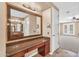 Bathroom vanity area with granite countertops, undermount sinks, and large framed mirror at 1755 E Tonto Dr, Chandler, AZ 85249
