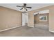 Neutral bedroom featuring mirrored closet doors and a ceiling fan, offering comfort and style at 1755 E Tonto Dr, Chandler, AZ 85249