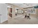 Exercise room features mirrored wall, ceiling fan, and a window with shutters at 1755 E Tonto Dr, Chandler, AZ 85249