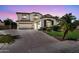 Inviting two-story home with a well-manicured lawn, mature trees, and a spacious driveway at 1755 E Tonto Dr, Chandler, AZ 85249