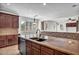 Spacious kitchen island with seating overlooks an open floorplan and views to the backyard at 1755 E Tonto Dr, Chandler, AZ 85249