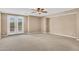 Large living room with double doors and neutral color palette at 1755 E Tonto Dr, Chandler, AZ 85249