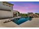 Stunning backyard pool with a waterfall feature, creating a tranquil oasis for relaxation at 1755 E Tonto Dr, Chandler, AZ 85249