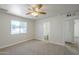 Bedroom featuring neutral carpet, a ceiling fan, and an en-suite bathroom at 17848 N 34Th Ln, Phoenix, AZ 85053