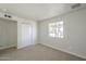 Well-lit bedroom with plush carpet, a closet, and a sunny window at 17848 N 34Th Ln, Phoenix, AZ 85053