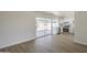 Open living area flowing into a modern kitchen, with backyard access through large sliding glass doors at 17848 N 34Th Ln, Phoenix, AZ 85053