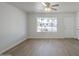 Bright living room featuring stylish wood floors and a large window with a view of the front yard at 17848 N 34Th Ln, Phoenix, AZ 85053