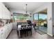 Cozy dining area with a chandelier and sliding glass doors leading to the backyard at 18474 W College Dr, Goodyear, AZ 85395