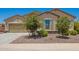 Charming single-Gathering home featuring a 2-car garage and well-maintained desert landscaping at 18474 W College Dr, Goodyear, AZ 85395
