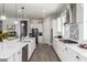 Modern kitchen with a large island, stainless steel appliances, and ample counter space at 18474 W College Dr, Goodyear, AZ 85395