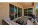 Outdoor patio with comfortable seating and sliding glass doors for indoor-outdoor living at 18474 W College Dr, Goodyear, AZ 85395