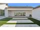 A covered back patio includes minimalist decor with a barbecue and large sliding glass doors at 19910 E Vallejo St, Queen Creek, AZ 85142