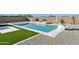 Beautiful backyard with pool, spa, and sport court, perfect for outdoor activities and relaxation at 19910 E Vallejo St, Queen Creek, AZ 85142