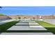 Resort-style backyard with pool, spa, basketball court, and artificial turf at 19910 E Vallejo St, Queen Creek, AZ 85142