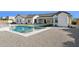 Expansive backyard showcasing a sparkling pool, basketball court, and well-manicured landscaping at 19910 E Vallejo St, Queen Creek, AZ 85142