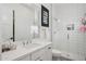 Modern bathroom with a sleek vanity, stand-up shower, and black and white mosaic tile at 19910 E Vallejo St, Queen Creek, AZ 85142