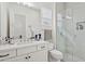 Modern bathroom with stone countertops, sleek fixtures, and a glass-enclosed shower with tiled details at 19910 E Vallejo St, Queen Creek, AZ 85142