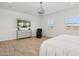 Minimal bedroom with wood floors, plantation shutters, and TV at 19910 E Vallejo St, Queen Creek, AZ 85142
