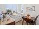 Bright breakfast nook with white cabinets, stone countertops and a drop leaf table set for two at 19910 E Vallejo St, Queen Creek, AZ 85142