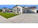 Lovely single-story home featuring a two-car garage and a well-manicured lawn at 19910 E Vallejo St, Queen Creek, AZ 85142
